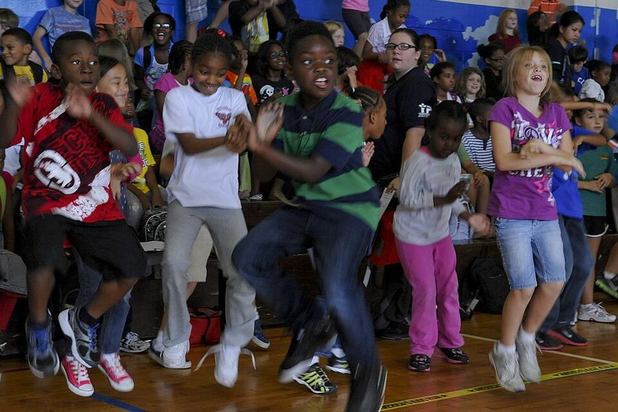 Kids dancing together at a school event